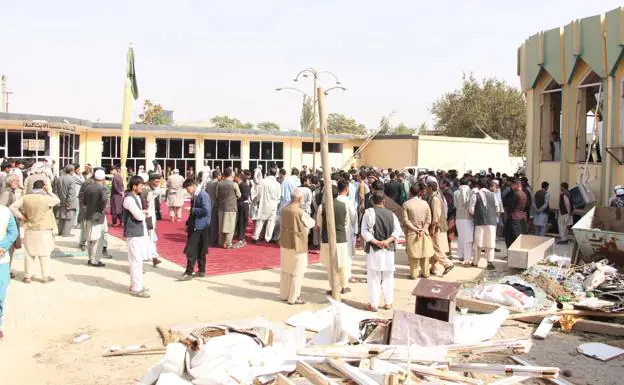 People visit the mosque where a huge explosion took place during Friday prayers.