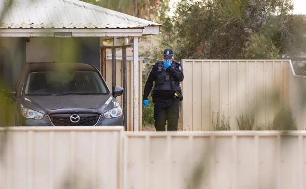 An Australian police officer at the house in Carnarvon where four-year-old Cleo Smith was rescued