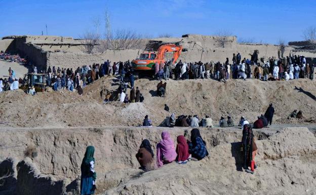 Rescuers try to reach and rescue a nine-year-old boy trapped for two days in a well in Zabul.