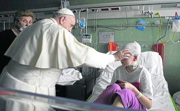 Pope Francis visits a sick child in the children's hospital in Rome.
