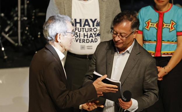 The president of the Colombian Truth Commission, Jesuit priest Francisco De Roux, delivers the final report to President-elect Gustavo Petro.