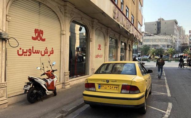 A store in Tehran closed due to anti-government protests.