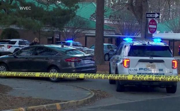 Numerous police vehicles surround the Virginia school center. 
